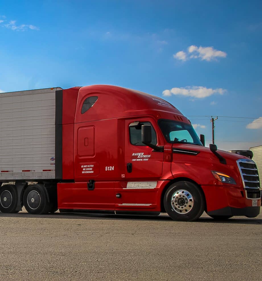 Student driver training in a Raider Express truck at Fort Worth CDL School